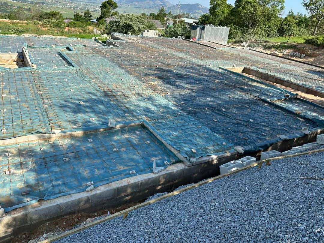 Concrete ground slab construction layers
